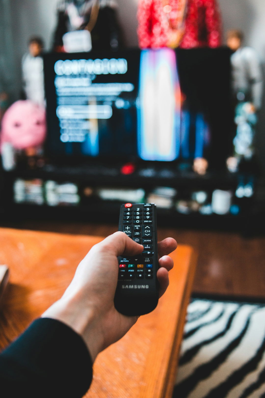 person-holding-black-remote-control.jpg person holding black remote control